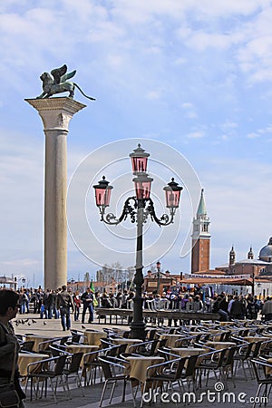 Italy. Venice. Pink street lamp. Murano glass and The Saint Marco coloumn with lion Editorial Stock Photo